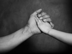 Schreier & Housewirth Family Law in Fort Worth, TX - Image of an Adult hand holding child hand