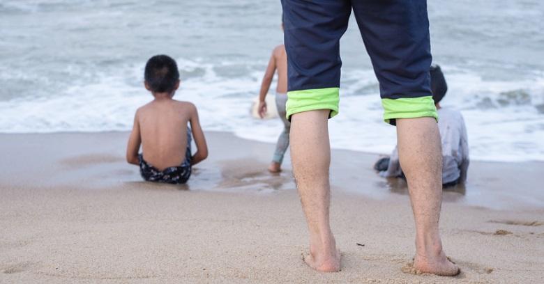 Schreier & Housewirth Family Law in Fort Worth, TX - Image of man with children at beach