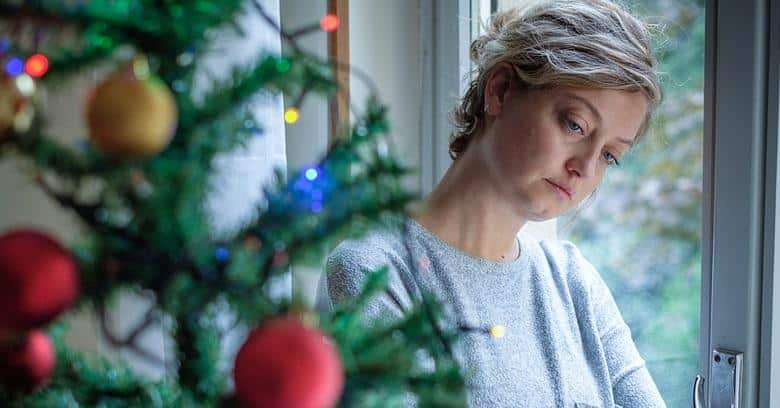 Schreier & Housewirth Family Law in Fort Worth, TX - Image of a worried woman during christmas